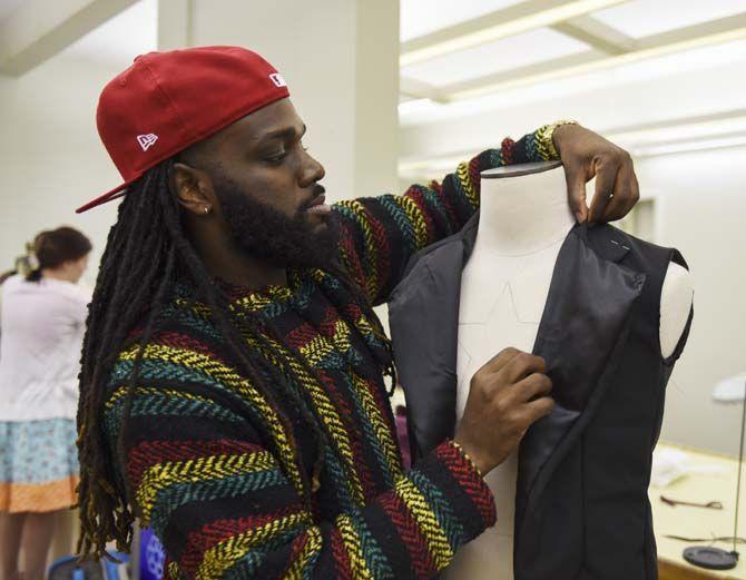 LSU apparel design senior Eric Prestley prepares his piece Tuesday, April 28, 2015 for the department&#8217;s ninth annual fashion show titled &#8220;Luminous&#8221;.