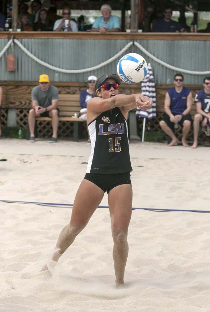 LSU freshman Mandi Orellana (15) digs the ball during the Tigers' 4-1 defeat against Florida International on Saturday, March 21, 2015 at Mango's Beach Volleyball Club.