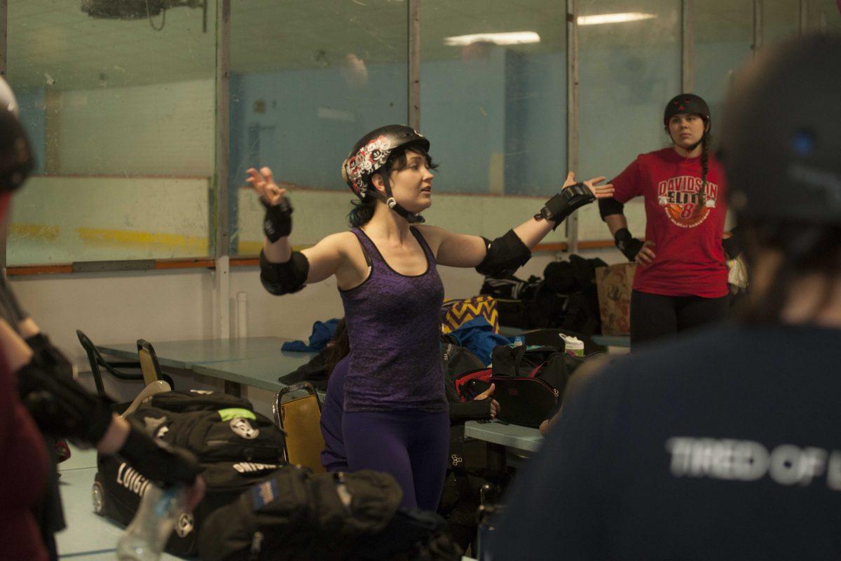 Co-captain Stacy &#8220;Jams&#8221; Sullivan talks to her team prior to a scrimmage at Leo&#8217;s Rollerland skating rink in Baton Rouge.