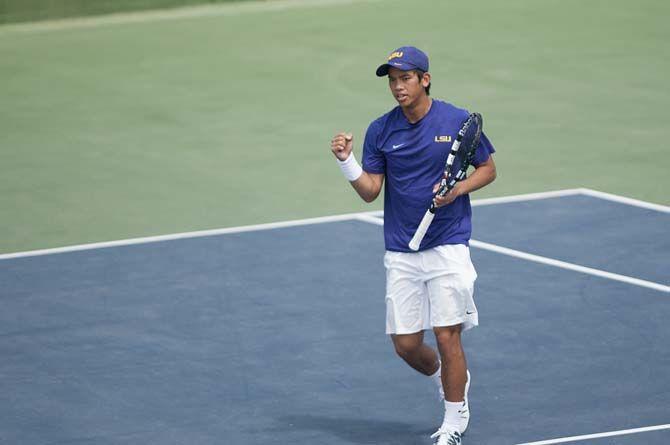 LSU junior Tam Trinh celebrates winning the doubles match during the Tigers' 6-1 victory against Arkansas on Sunday, March 29, 2015 in the W.T. "Dub" Robinson Stadium.