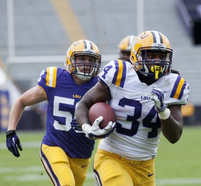 LSU sophomore runningback Darrel Williams (34) runs the ball during LSU white squad's 45-6 victory over LSU purple squad during the annual Spring Football game on Saturday, April 18, 2015 in Tiger Stadium.