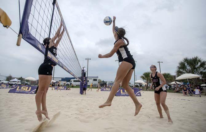 LSU freshman Mandi Orellana (15) kills the ball during the Tigers' 5-0 victory against Spring Hill on Saturday, March 21, 2015 at Mango's Beach Volleyball Club.