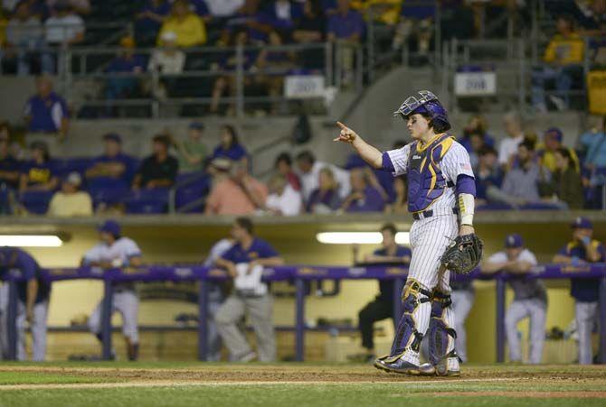 LSU senior catcher Kade Scivicque (22) gestures to the mound Tuesday, April 21, 2015, during the Tigers' 6-0 victory against Tulane at Alex Box Stadium.