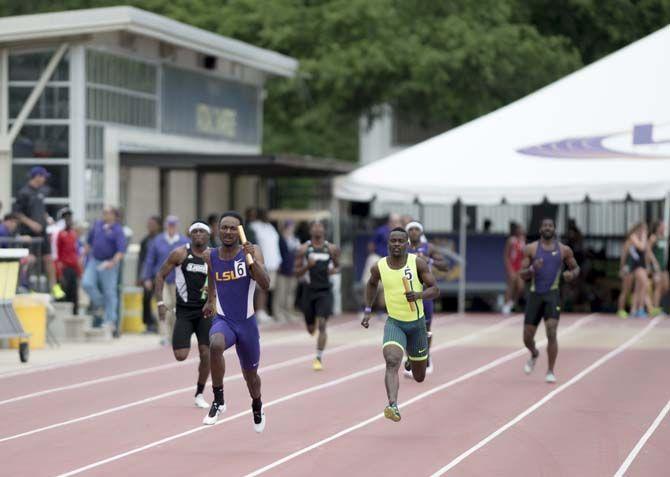 LSU senior Aaron Ernest runs the men 4x100 meter relay during the 2015 LSU Invitational Battle on the Bayou on Saturday, April 4, 2015, at the Bernie Moore Stadium.