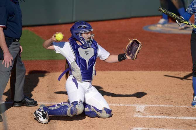 LSU junior catcher Kellsi Kloss (77) throws the ball back to the pitcher on Saturday, Feb. 7, 2015 during the Tiger' 10-0 victory against Tennessee State in Tiger Park.