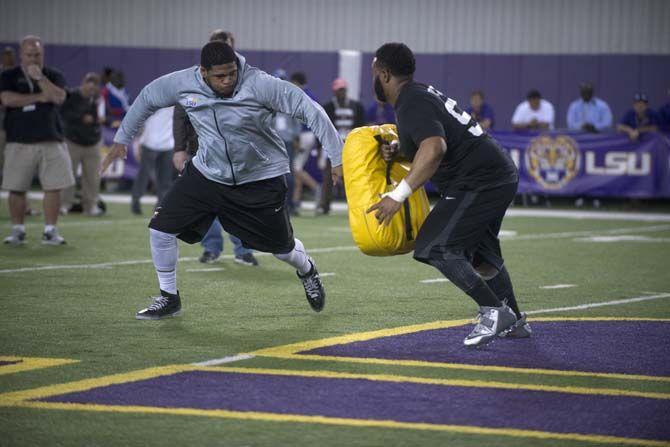 LSU offensive lineman La'el Collins (70) runs a drill on Friday, Mar. 27 2015 on LSU football Pro Day at the football operations indoor facility.