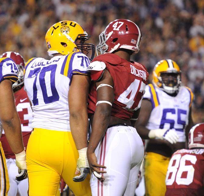 LSU senior offensive tackle La'el Collins (70) gets in the face of Alabama senior linebacker Xzavier Dickson (47) Saturday, Nov. 8, 2014 during the Tigers' 20-13 loss against the Crimson Tide in Tiger Stadium.