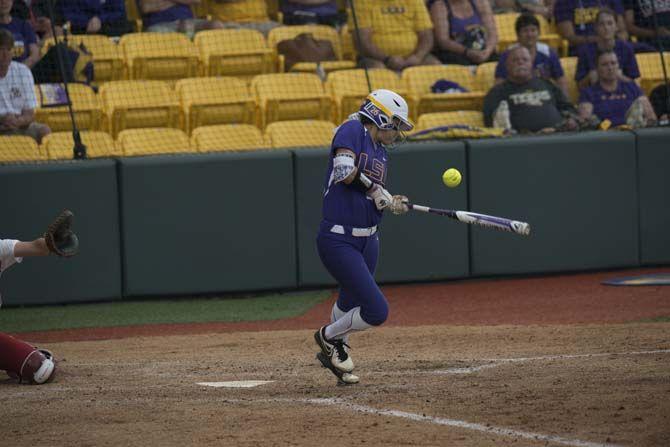 LSU sophomore outfield Bailey Landry (26) hits the ball during the Tigers' 10-2 victory against Oklahoma Saturday, March 21, 2015 in Tiger Park.