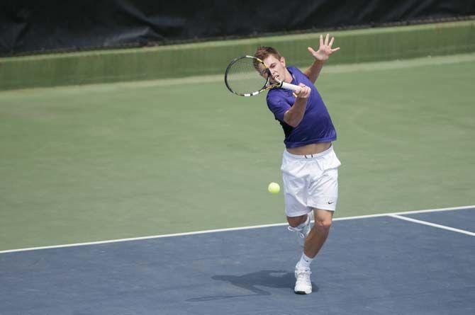 LSU senior Chris Simpson hits the ball during the Tigers' 6-1 victory against Arkansas on Sunday, March 29, 2015 in the W.T. "Dub" Robinson Stadium.