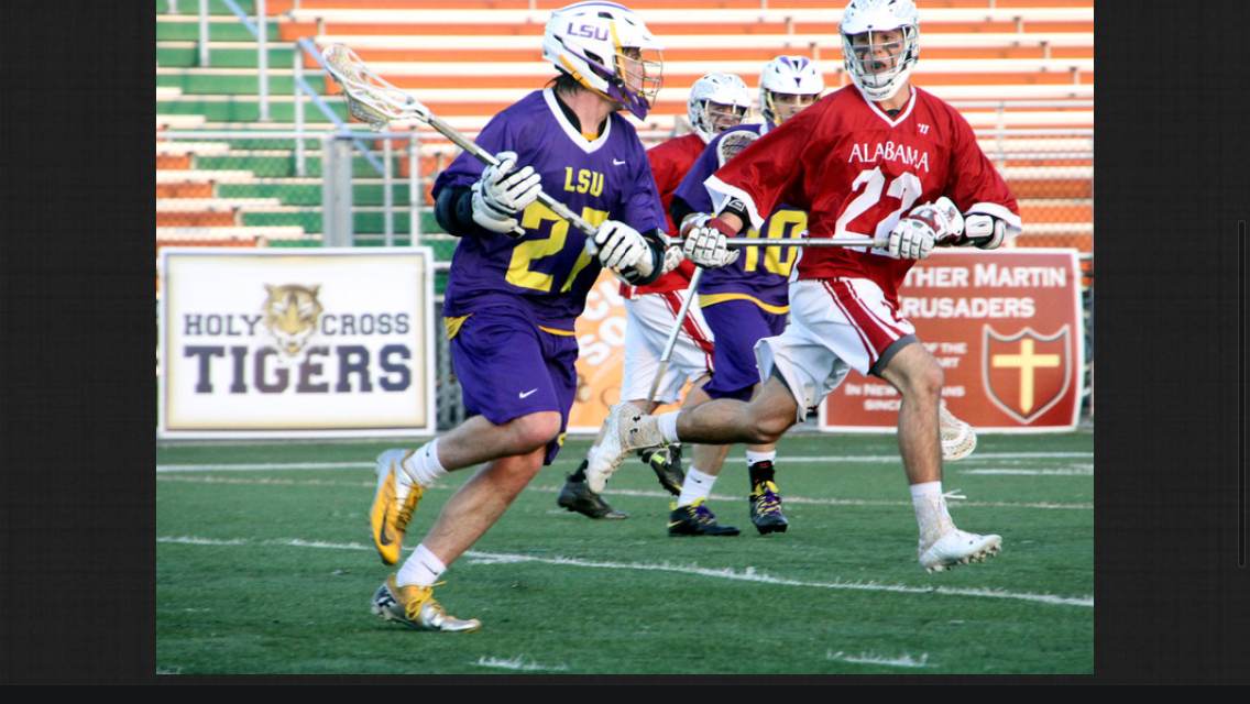 LSU lacrosse player Thomas Brown runs upfield during an LSU lacrosse match (Photo courtesy of Barry Spears).