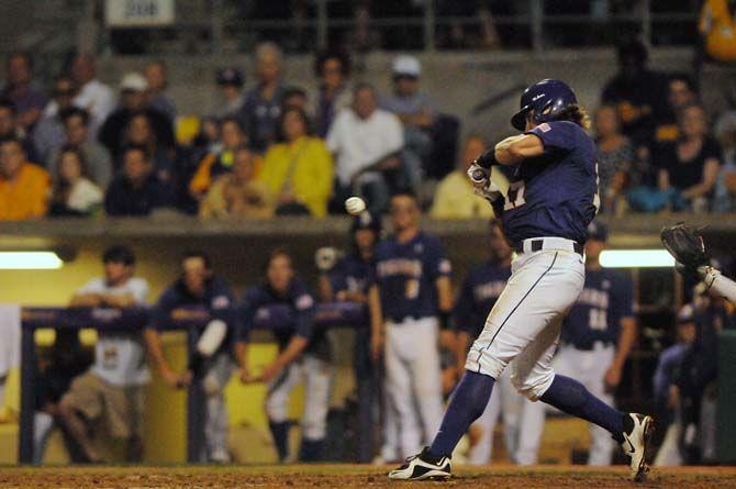 LSU senior outfielder, Jared Foster (17), makes contact with the ball during LSU's 9-6 win at game two of the SEC Championships against Texas A&amp;M on Friday, April 24, 2015 in Alex Box Stadium.