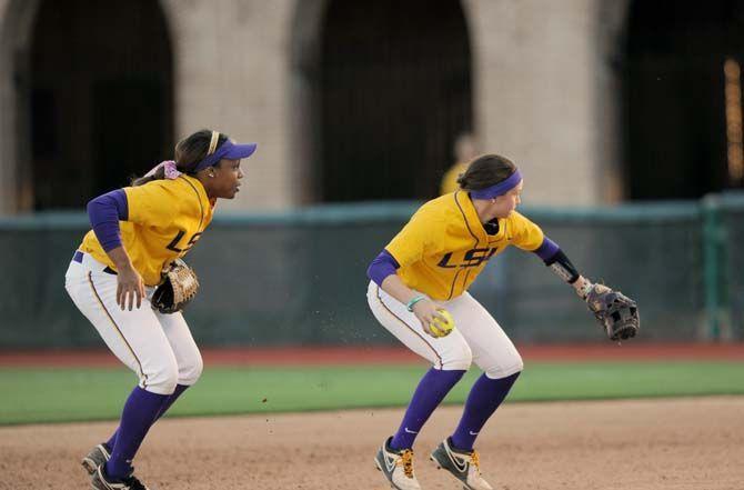 LSU junior infielder Bianca Bell (27) and freshman infielder Sydney Bourg (10) play the field on Wednesday, Apr. 29, 2015 in winning game 11-0 against Southeastern.