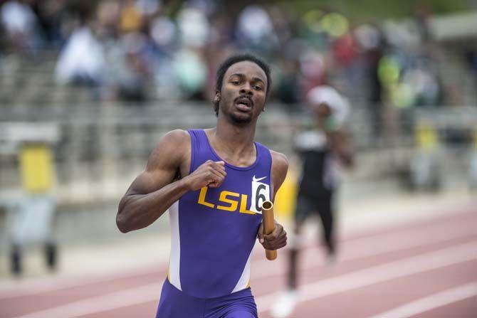 LSU senior Aaron Ernest runs the men 4x100 meter relay during the 2015 LSU Invitational Battle on the Bayou on Saturday, April 4, 2015, at the Bernie Moore Stadium.