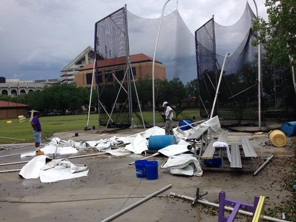 A cleanup crew assess damage outside Bernie Moore Track Stadium after Monday morning's tornado warning.&#160;