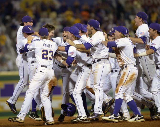 LSU sophomore infielder Danny Zardon (27) is rushed by his teammates after hitting the final home run on Thursday, April 23, 2015, during the Tigers' 4-3 win against the Aggie's in Alex Box Stadium.