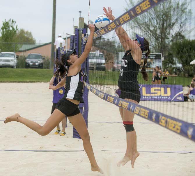 LSU sophomore Katarina Raicevic (11) hits the ball during the Tigers' 5-0 victory against Spring Hill on Saturday, March 21, 2015 at Mango's Beach Volleyball Club.