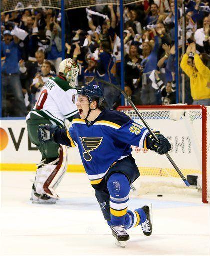 St. Louis Blues right wing Vladimir Tarasenko reacts after scoring his first of two goals in the first period during a first-round hockey playoff game between the St. Louis Blues and the Minnesota Wild on Saturday, April 18, 2015, at the Scottrade Center in St. Louis. At left is Minnesota Wild goaltender Devan Dubnyk. (Chris Lee/St. Louis Post-Dispatch via AP) EDWARDSVILLE INTELLIGENCER OUT; THE ALTON TELEGRAPH OUT; MANDATORY CREDIT