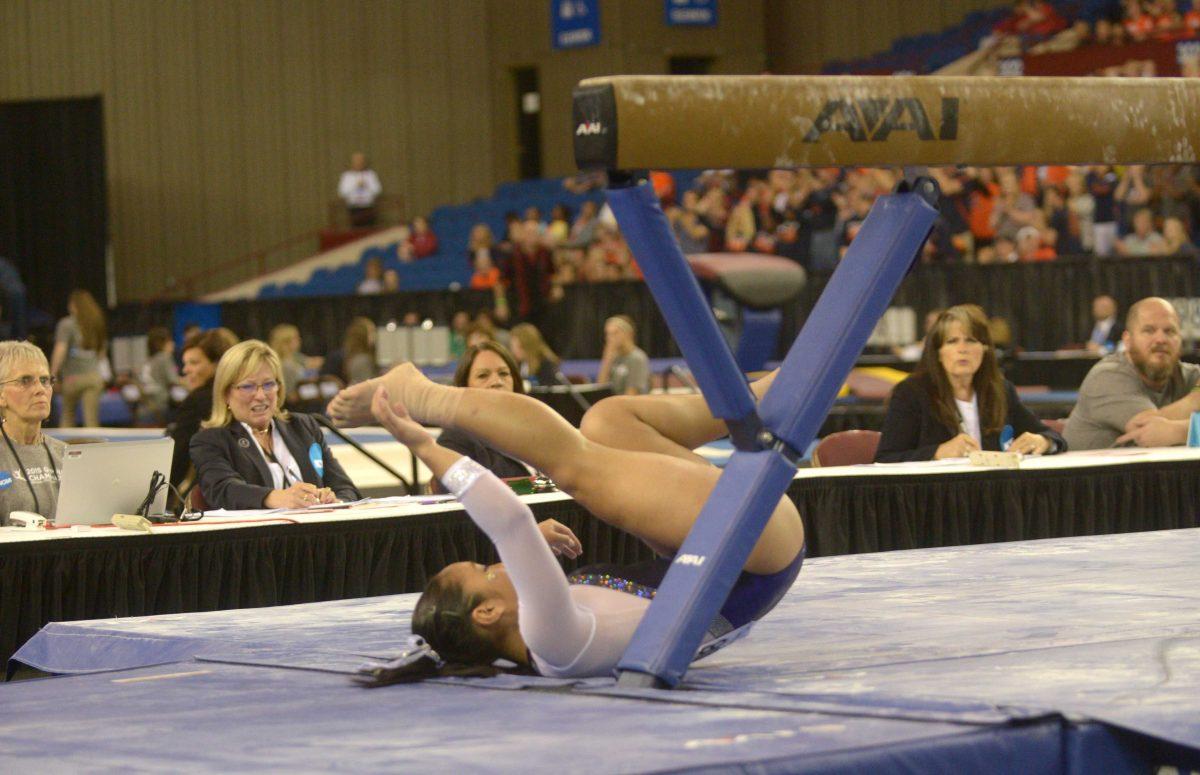 LSU freshman all-around Erin Macadaeg falls from the beam during the 2015 NCAA gymnastics championships on Friday, April 17, 2015 in Fort Worth, Texas.