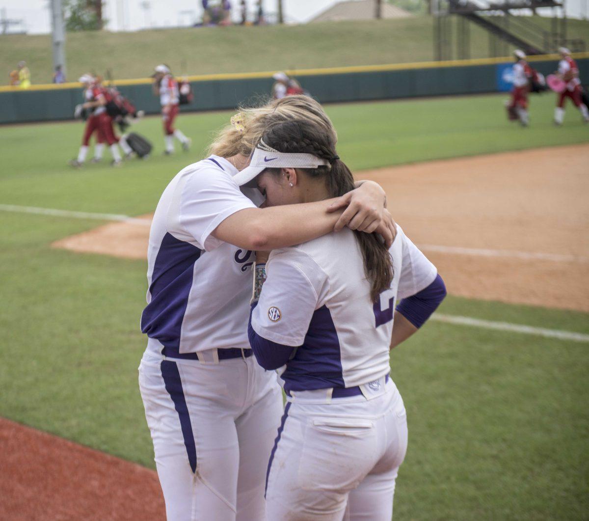 LSU freshman pitcher Carley Hoover (21) hugs sophomore infielder Sahvanna Jaquis after the Tiger's 1-0 defeat against Arizona St. on Saturday, May 16, 2015 in Tiger Park.