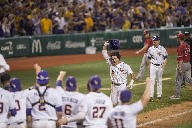 LSU senior outfielder Chris Sciambra (5) reacts after a walk-off shot in the ninth inning during the Tiger's 4-3 first victory in the NCAA Super Regional against ULL on Saturday, June 6, 2015 in the Alex Box Stadium.