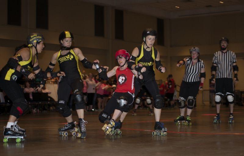 Red Stick Roller Derby Jammer 'Fun Size' tries to break through a block during the All Stars 342-127 victory against the Yellow Rose Derby Girls All Stars May 16 at the Baton Rouge River Center.&#160;