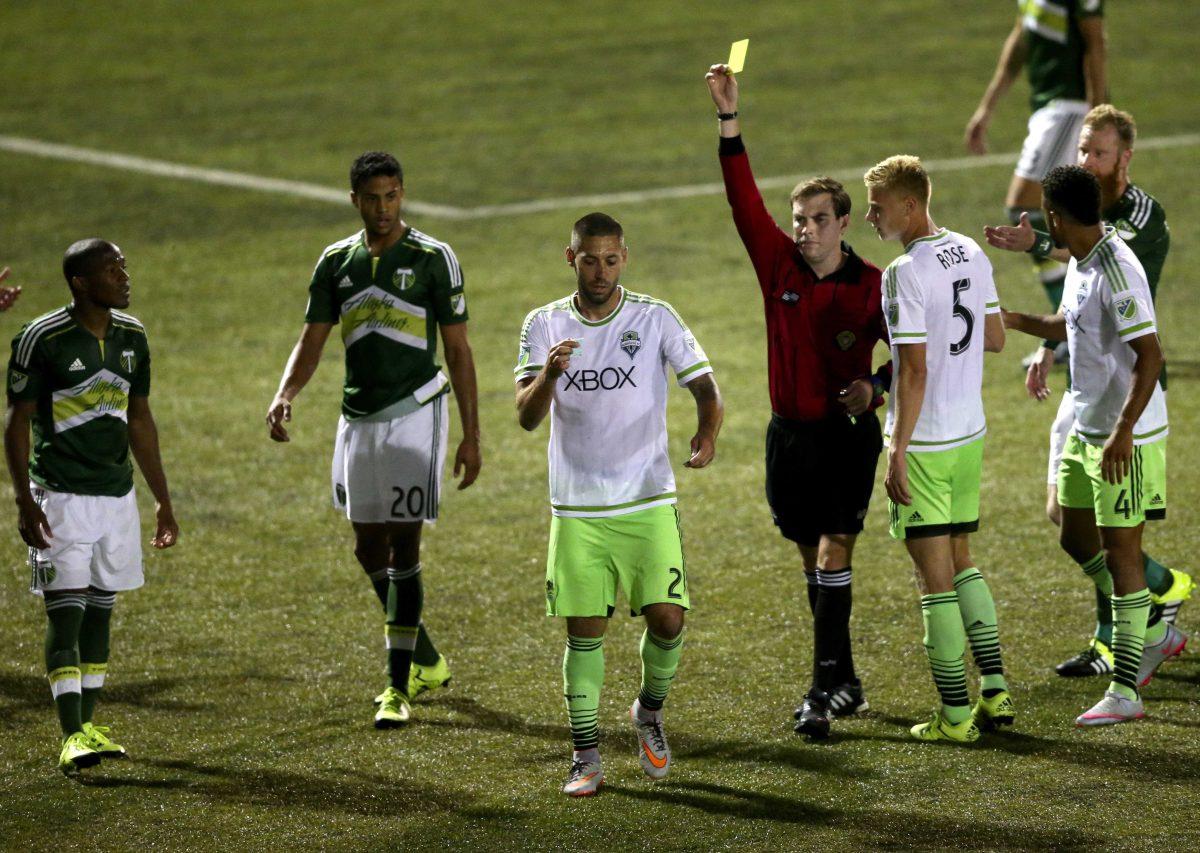 In this photo taken Tuesday, June 16, 2015, Seattle Sounders FC's forward Clint Dempsey (2) appears to rip up referee Daniel Radford's notebook after Radford issued a red card to teammate Michael Ariza while playing the Portland Timbers in a U.S. Open Cup soccer match at Starfire Stadium in Tukwila, Wash. Dempsey was issued a red card his actions. (Erika Schultz/The Seattle Times via AP) SEATTLE OUT; USA TODAY OUT; MAGS OUT; TELEVISION OUT; NO SALES; MANDATORY CREDIT TO BOTH THE SEATTLE TIMES AND THE PHOTOGRAPHER