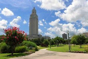 The Louisiana State Capitol building basks in sunlight Wednesday near the Claiborne Conference Center in downtown Baton Rouge.