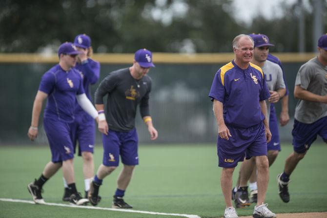 LSU head coach Paul Mainieri walks with his players during the Tigers' third practice at the NCAA College World Series on Monday, June 15, 2015 in Creighton University Sports Complex.