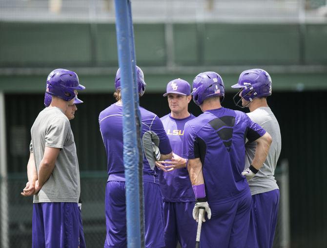 LSU hitting coach Andy Cannizaro (11) talks to LSU baseball players during the Tigers' third practice at the NCAA College World Series on Monday, June 15, 2015 in Creighton University Sports Complex.