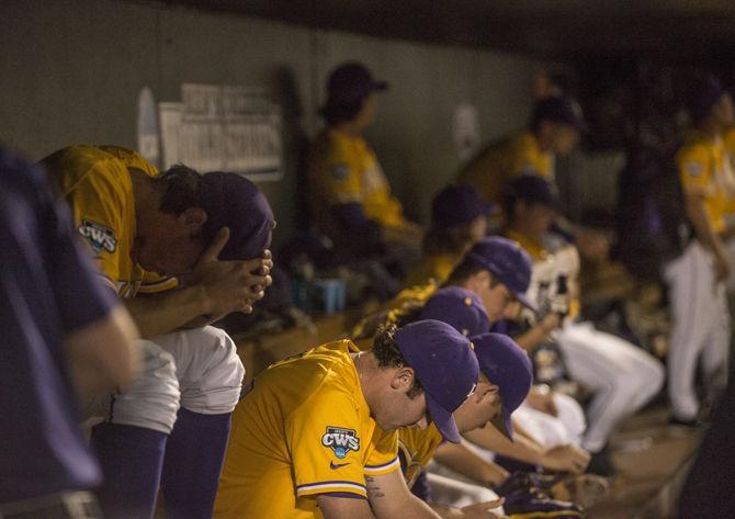 LSU baseball players sit in the dugout after the Tigers' 8-4 final defeat against TCU in the NCAA Men's College World Series on Thursday, June 18, 2015 at the TD Ameritrade Park in Omaha.