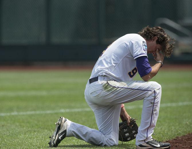 LSU junior outfielder Mark Laird (9) reacts after missing a foul ball during the Tigers' 10-3 defeat against TCU in the NCAA Men's College World Series on Sunday, June 14, 2015 at the TD Ameritrade Park in Omaha.