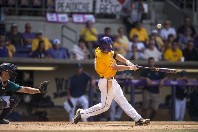 LSU junior infielder Alex Bergman (8) hits a fly ball during the Tiger's 2-0 final victory against UNC Wilmington to give LSU baseball team it&#8217;s 21st NCAA Regional Championship on Monday, June 1, 2015 in Alex Box Stadium.