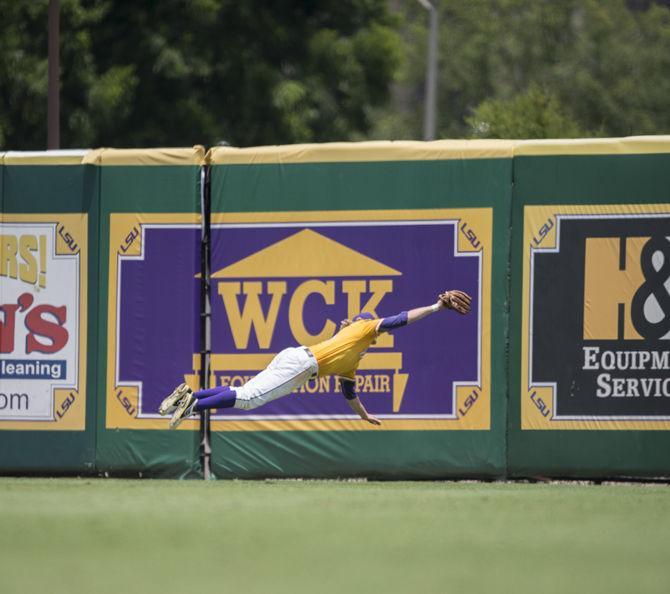 LSU junior outfielder Andrew Stevenson (6) dives to catch a ball during the Tiger's 2-0 final victory against UNC Wilmington on Monday, June 1, 2015 in Alex Box Stadium.