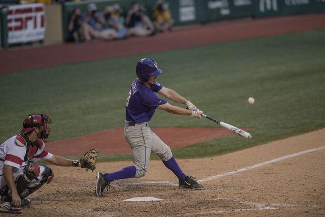 LSU junion infielder Alex Bregman (8) hits the ball during the Tiger's 6-3 final victory in the NCAA Super Regional against ULL on Sunday, June 7, 2015 in the Alex Box Stadium.