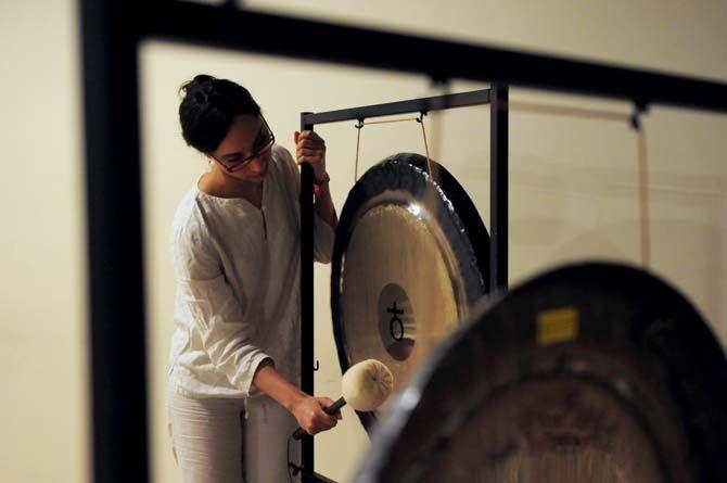 Olivia Sophia of Calming Tones performs on the gong on Saturday, June 20, 2015 during a summer solstice gong bath at The Red Shoes.