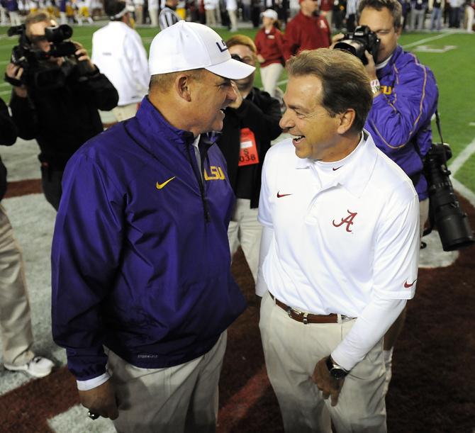 LSU head coach Les Miles and Alabama head coach Nick Saban meet at midfield Saturday, Nov. 9, 2013 before the Tiger's 38-17 loss to the Alabama Crimson Tide at Bryant-Denny Stadium in Tuscaloosa, AL.