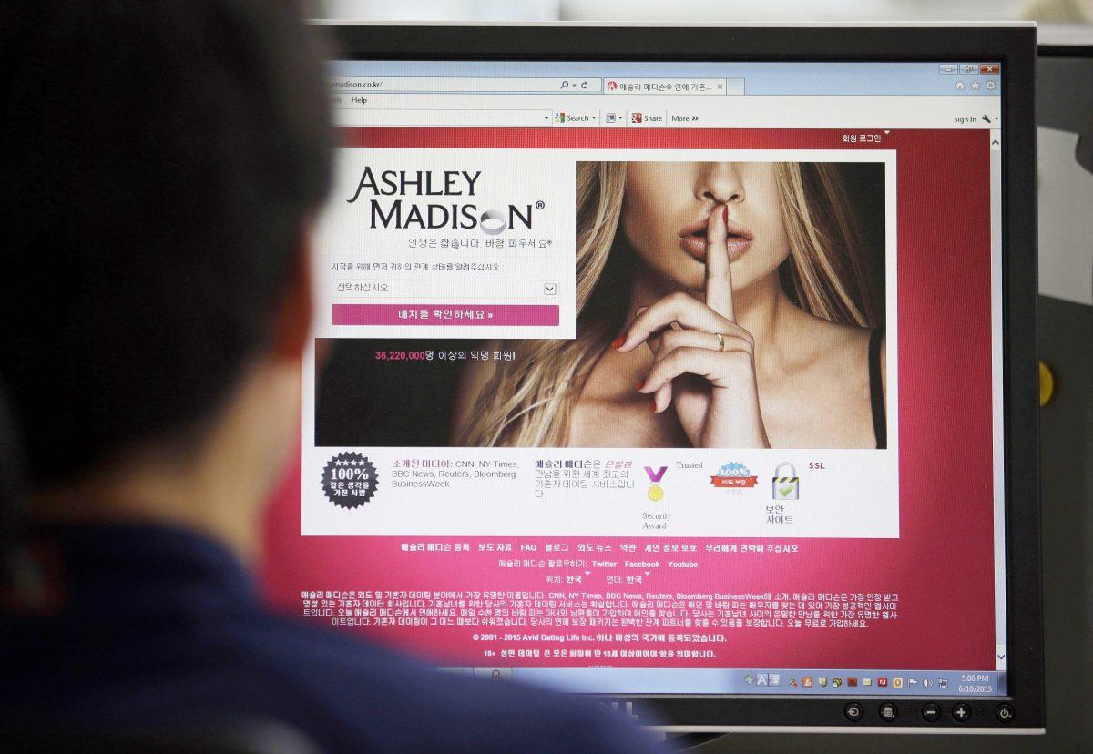 In this June 10, 2015 photo, Ashley Madison's Korean web site is shown on a computer screen in Seoul, South Korea. Avid Life Media Inc., the parent company of Ashley Madison, a matchmaking website for cheating spouses, said it was hacked and that the personal information of some of its users was posted online. The breach was first reported late Sunday, July 19, 2015, by Brian Krebs of Krebs on Security, a website that focuses on cybersecurity. (AP Photo/Lee Jin-man, File)