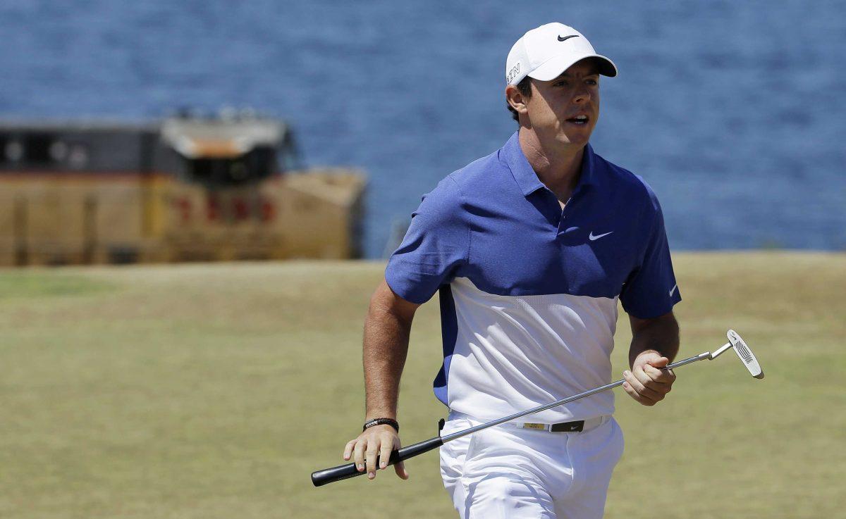 FILE - A Sunday, June 21, 2015 file photo showing Rory McIlroy, of Northern Ireland, walking off the second green during the final round of the U.S. Open golf tournament at Chambers Bay in University Place, Wash. World number one Rory McIlroy has ruptured a ligament in his left ankle while playing soccer less than before the start of his British Open title defense. The Northern Irish golfer gave no indication how long he would be out in the announcement Monday, July 6, 2015, on his Instagram account, only saying that he is &#8220;working hard to get back as soon as I can.&#8221; (AP Photo/Ted S. Warren, File)