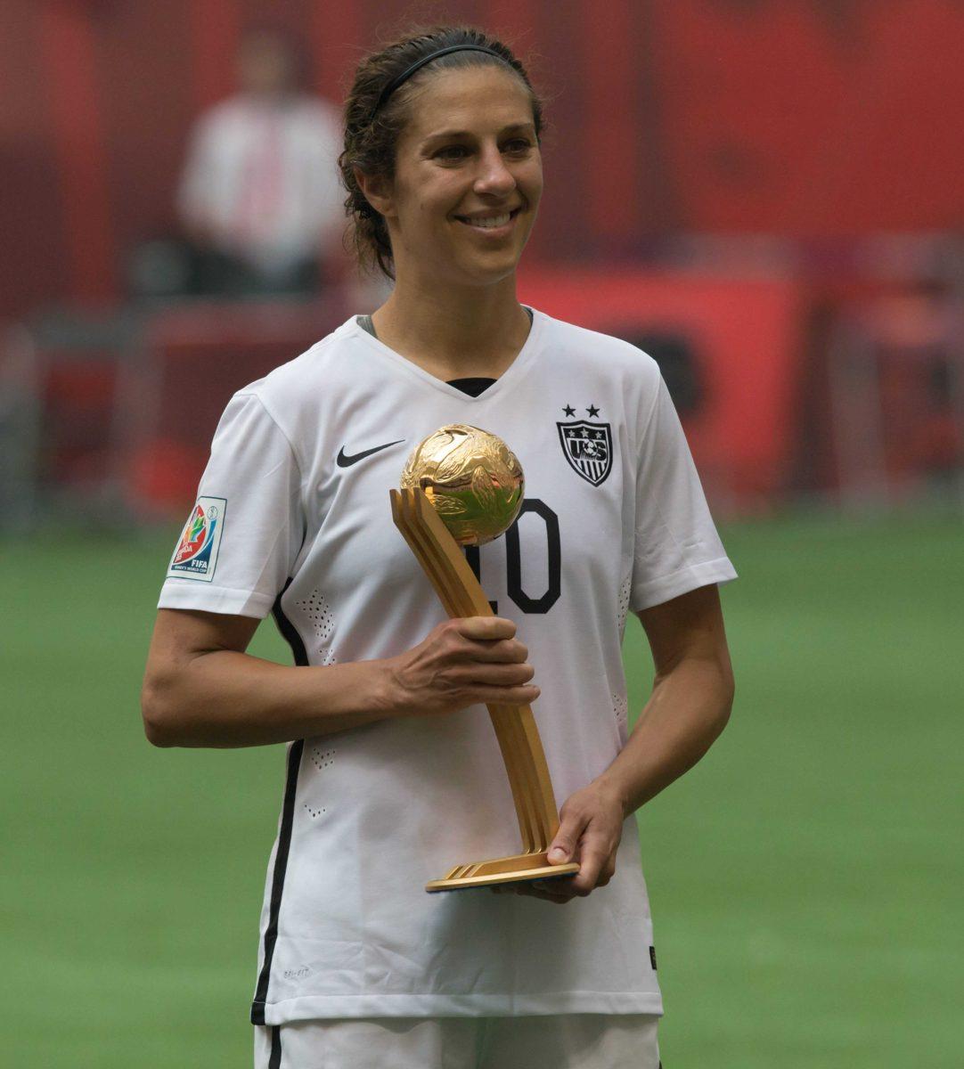 United States' Carli Lloyd holds her Golden Ball award which was presented after the United States defeated Japan to win the FIFA Women's World Cup soccer championship in Vancouver, British Columbia, Canada, Sunday, July 5, 2015. (Jonathan Hayward/The Canadian Press via AP)&#160;