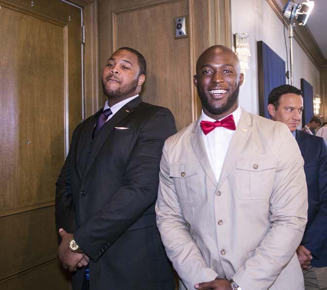 LSU senior offensive tackle, Vadal Alexander (74), and sophomore running back, Leonard Fournette (27), pose for pictures during SEC Media Days on Thursday, July 16, 2015 in Hoover, Alabama.