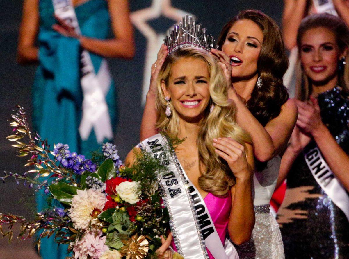 Miss Oklahoma Olivia Jordan is crowned Miss USA by Miss USA 2014 Nia Sanchez during the 2015 Miss USA pageant in Baton Rouge, La., Sunday, July 12, 2015. (AP Photo/Derick E. Hingle)