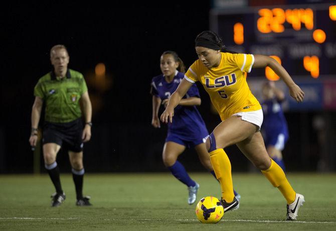 LSU sophomore forward Jorian Baucom (5) advances the ball down the field as Northwestern State junior midfielder Camila Ardila (3) trails behind on Tuesday, Aug. 25, 2015, during the Tigers' 1-1 tie against the Lady Demons at LSU Soccer Stadium.