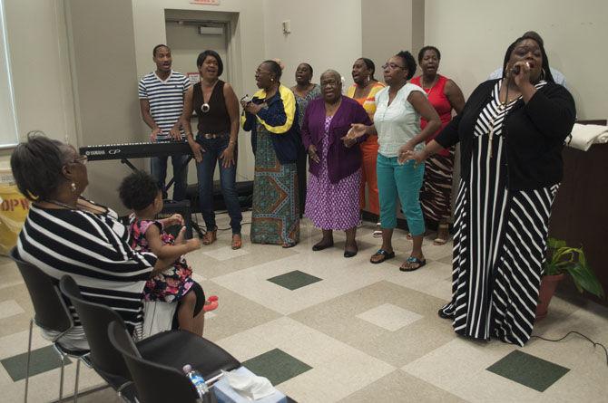 Magnolia Baptist Church Choir sings at the event's reception on Saturday, Aug. 29, 2015, at Greenwell Springs Library located in Baton Rouge.