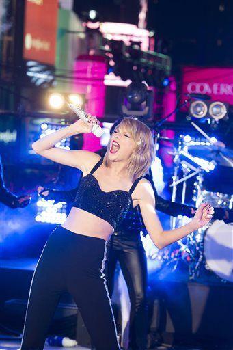 Taylor Swift performs in Times Square during New Year's Eve celebrations on Wednesday, Dec. 31, 2014 in New York. (Photo by Charles Sykes/Invision/AP)