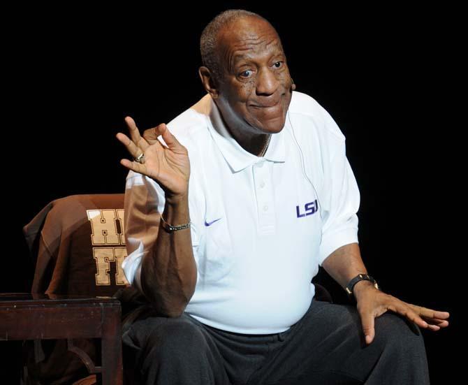 Bill Cosby imatates his wife fixing her makeup on the way to the hospital to give birth during his two hour comedy performance at the Baton Rouge River Center on Sunday, Oct. 4.