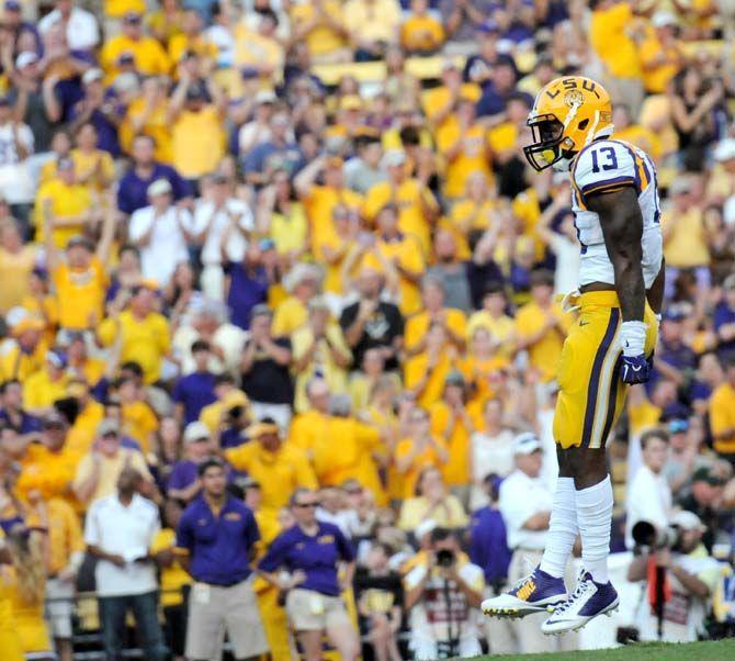 LSU sophmore cornerback Dwayne Thomas (13) celebrates after tackleing Mississippi State junior quarterback Dak Prescott (15) in Tiger Stadium where LSU lost 34-29 Saturday September 20, 2014.