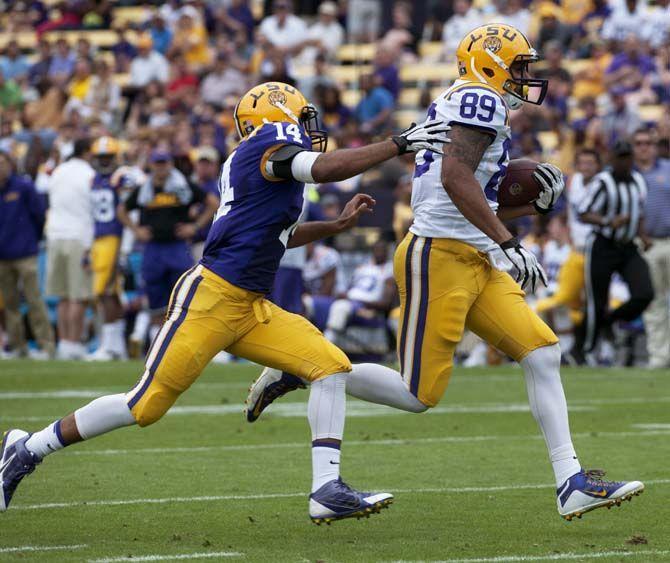 LSU sophommore tight end DeSean Smith (89) outruns sophomore safety Lionel Williams (14) during LSU white squad's 45-6 victory over LSU purple squad during the annual Spring Football game on Saturday, April 18, 2015 in Tiger Stadium.