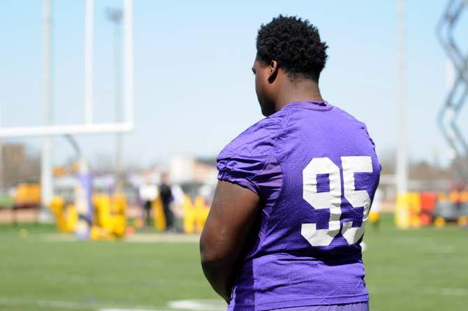 LSU senior DT Quentin Thomas (95) watches practice from the sidelines on Saturday, Mar. 07, 2015 during the first spring practice at the Football Operations practice field.