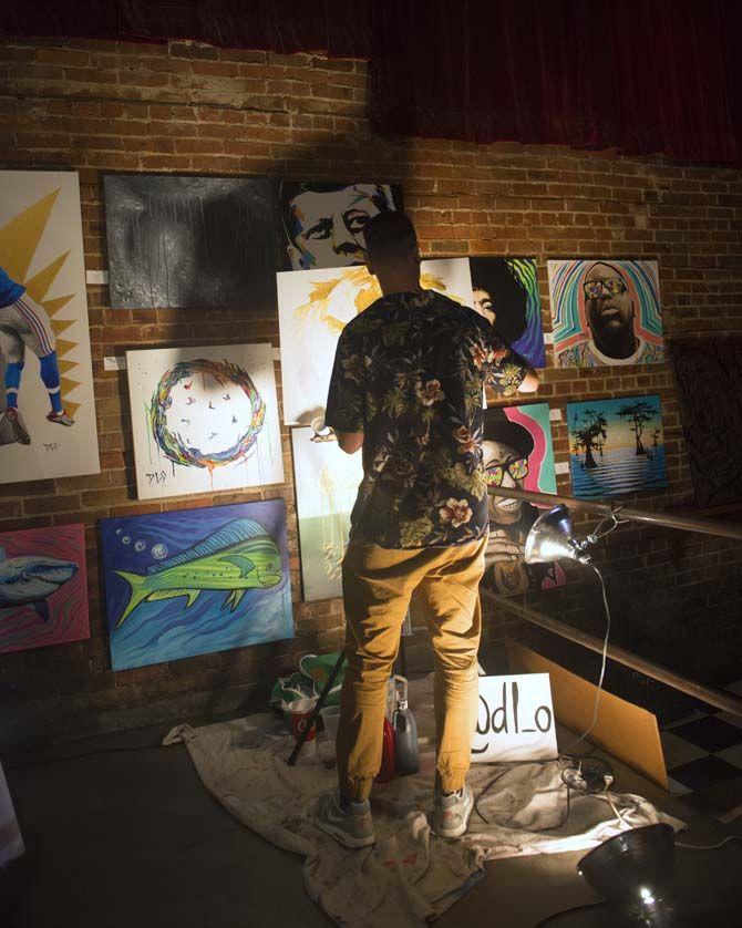 Artist, David Losavio produces live painting during the art show on Wednesday, August 19, 2015, at the Varsity Theater.