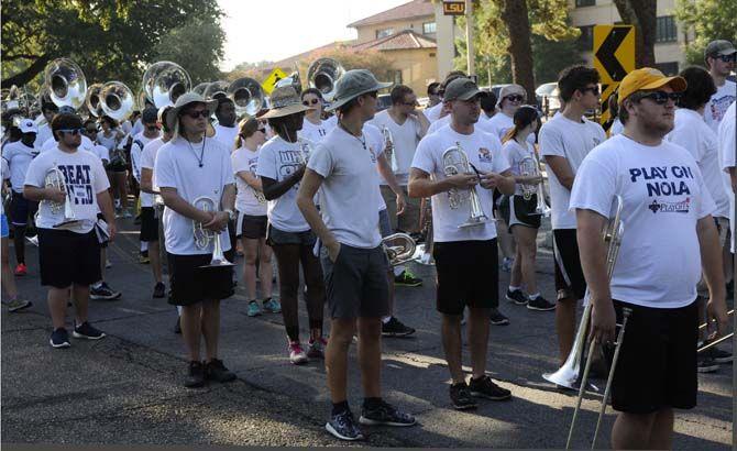 Tiger Band brass players get set in block for the march to Tiger Stadium on Saturday Aug. 22, 2015, on LSU's campus.